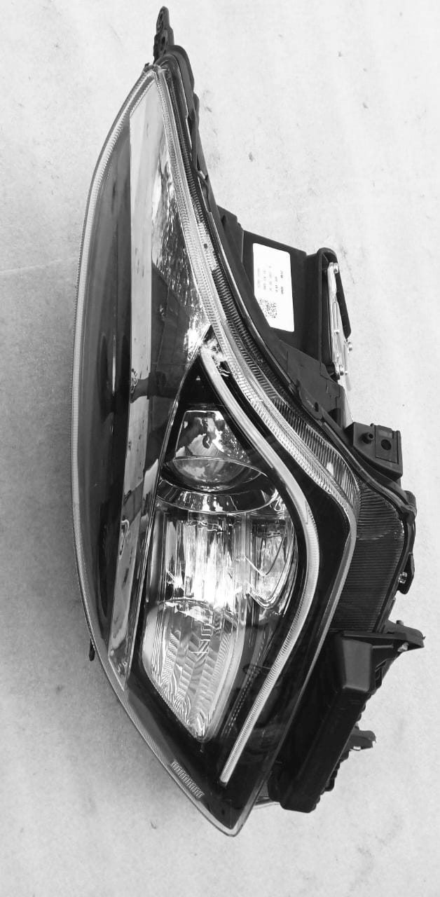 Suzuki Baleno head lamp unit LH replacement part by CarTrends, showing the front view of the spare headlamp for vehicle lighting.