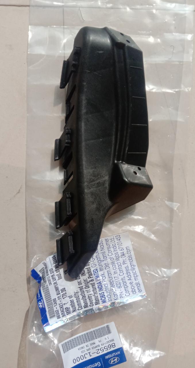 CarTrends I10 bumper bracket spare part, close-up of durable black bumper bracket for vehicle repair.
