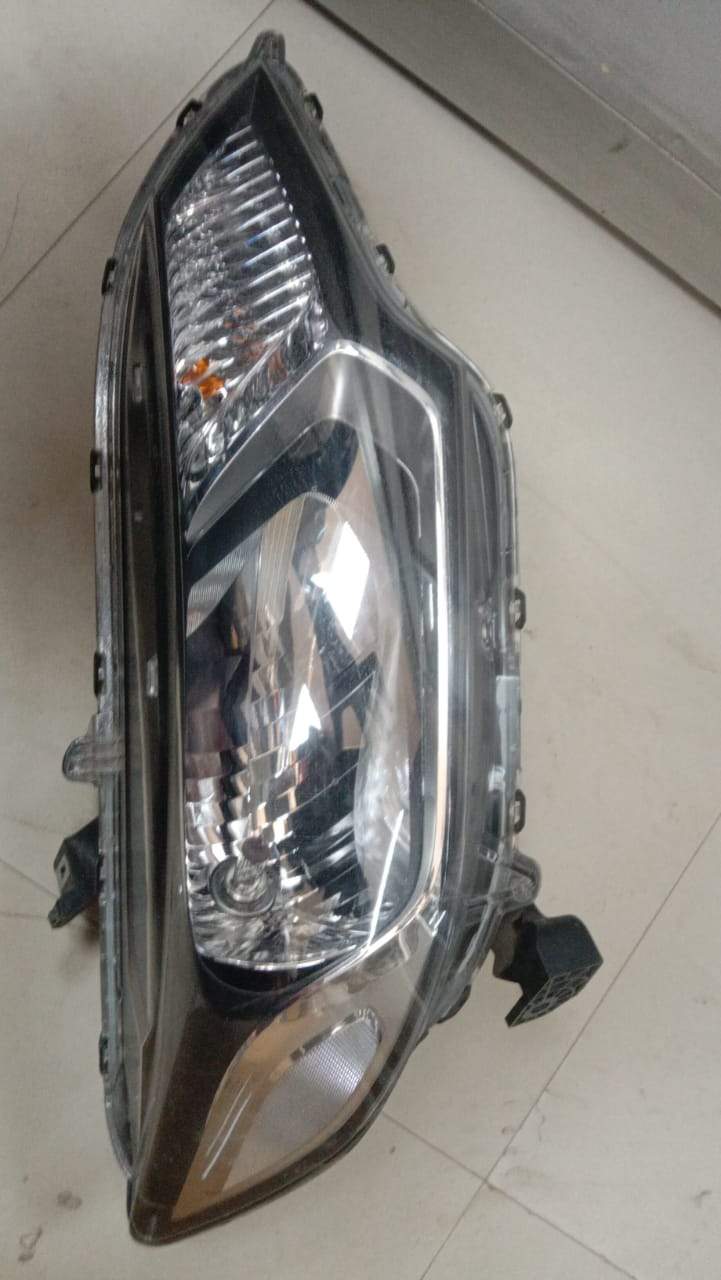 CarTrends Honda City Type 5 right head lamp spare part, clear view of the automotive headlight for the right side.