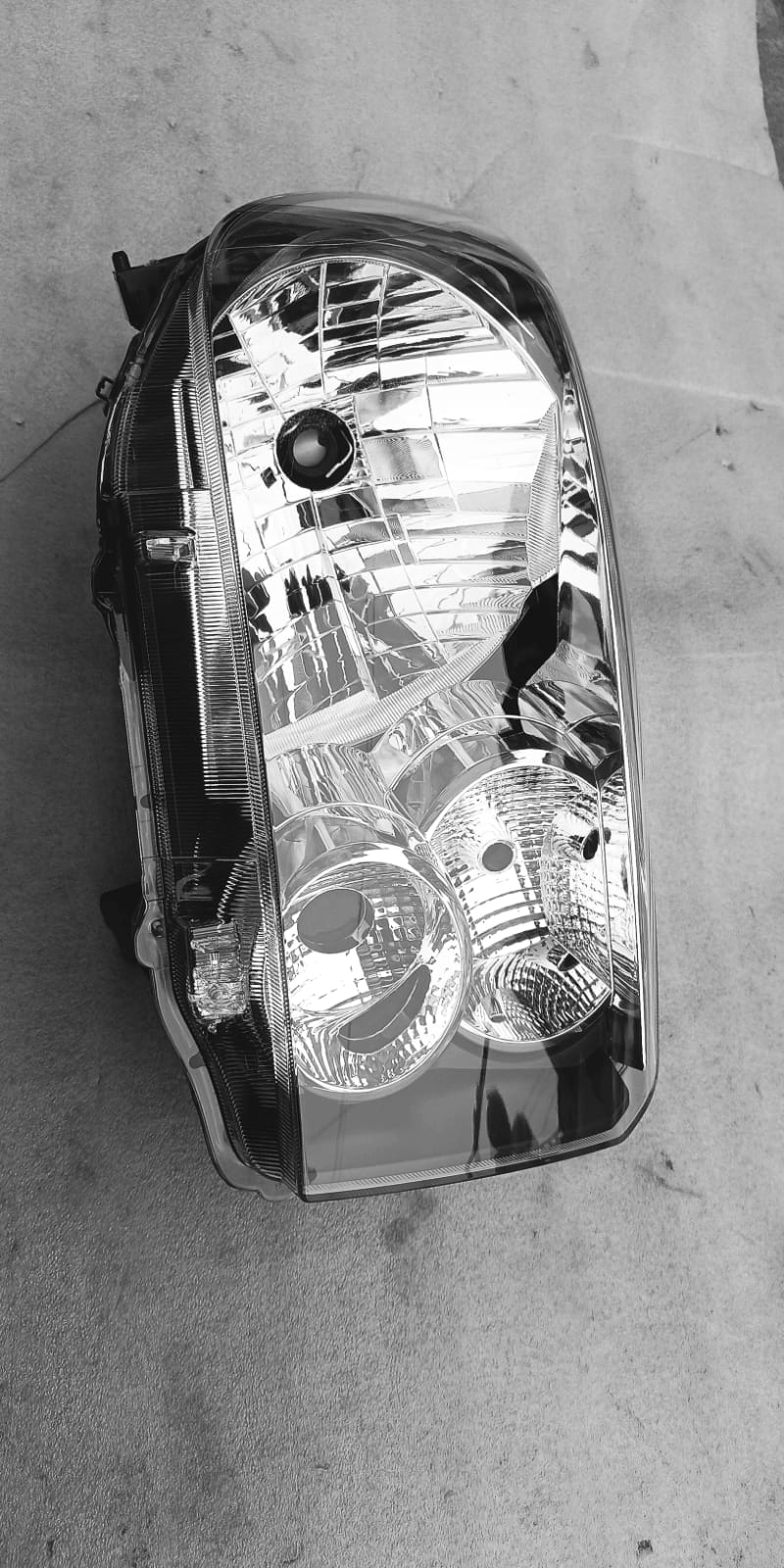 Right side headlamp for Suzuki Celerio spare part by CarTrends, showing the headlamp assembly with lens and mounting details.