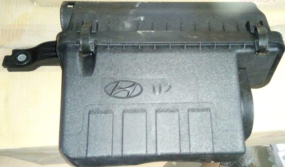 Hyundai Xcent air cleaner assembly spare part by CarTrends, showing the filter and housing for engine air intake.