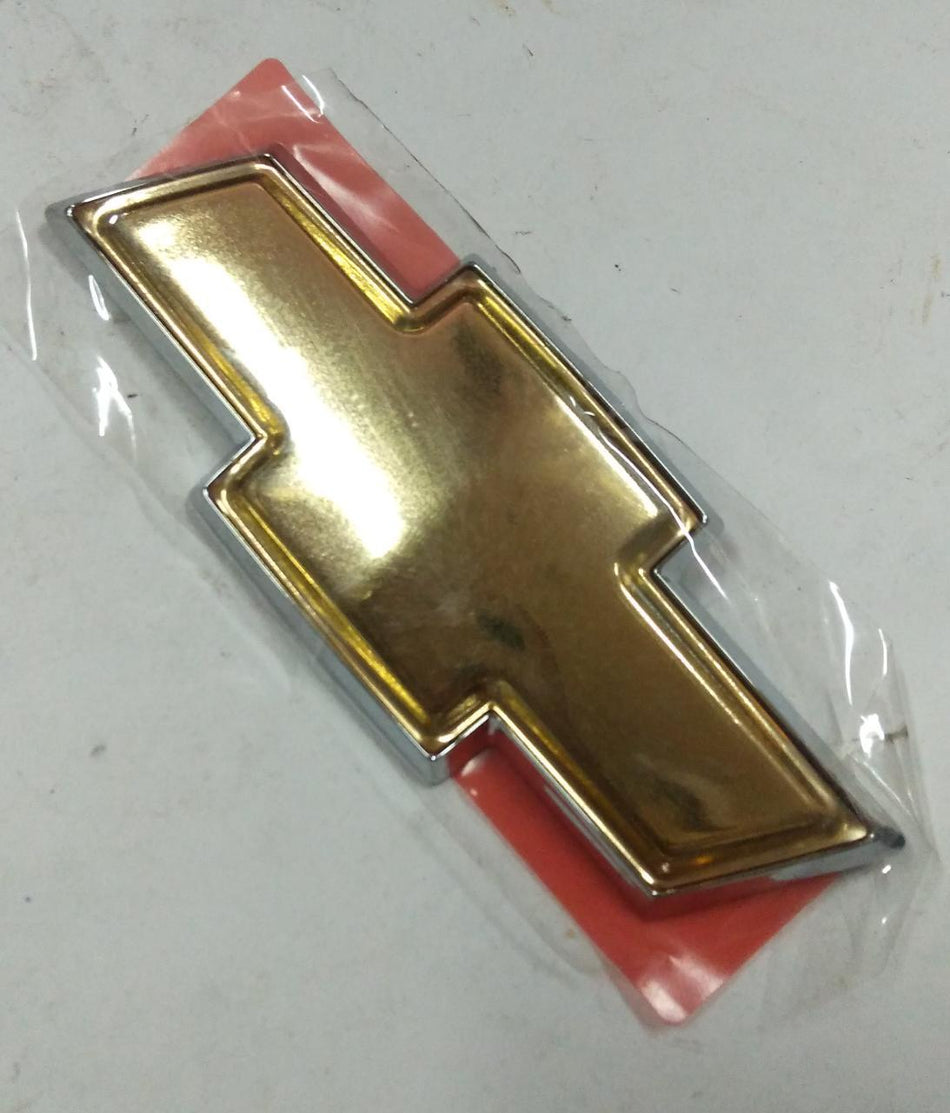 CarTrends Chevrolet Spark emblem, genuine spare part, close-up image showing the chrome emblem with Chevrolet logo.