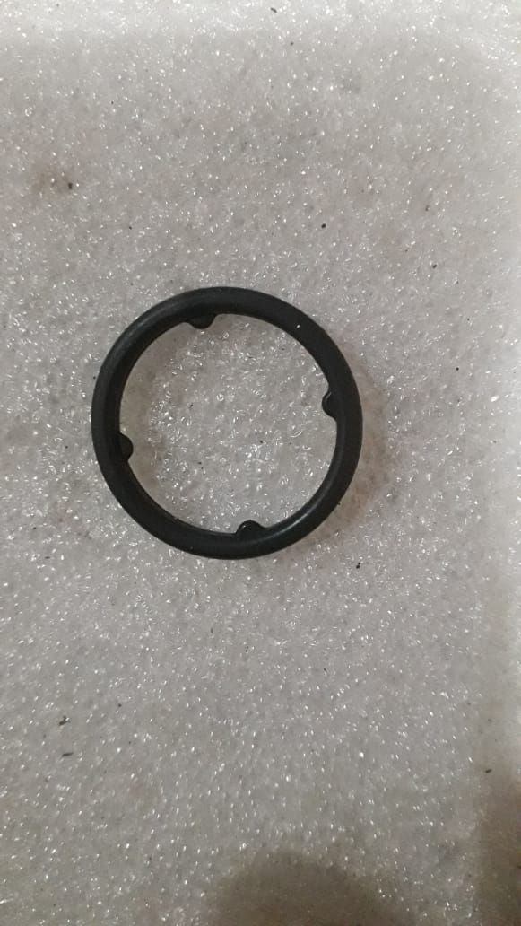 CarTrends Chevrolet Beat seal oil pump O-ring, close-up of spare part showing rubber gasket for engine oil seal replacement.