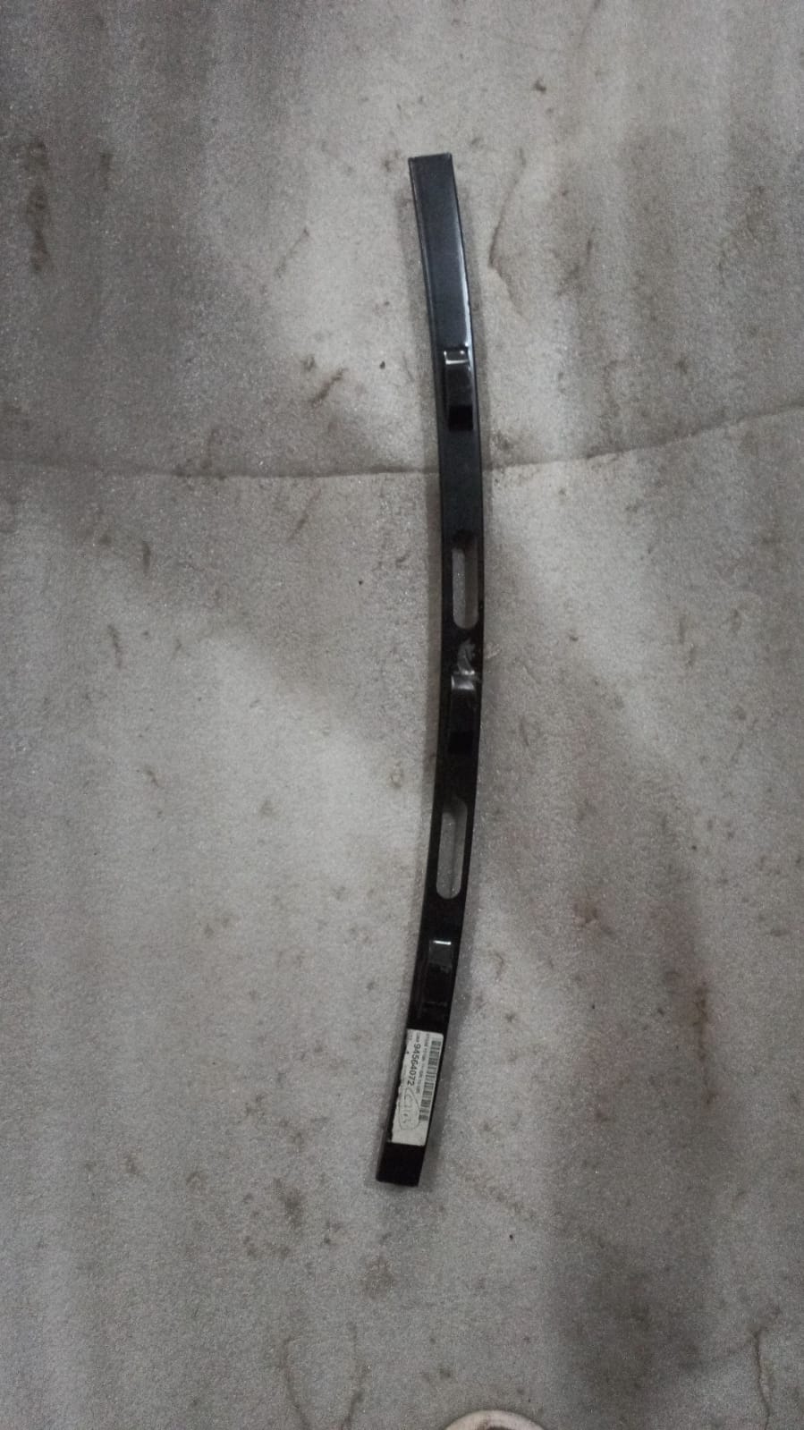 CarTrends J94564072 rear right window guide for Beat, a spare car part shown in the image.