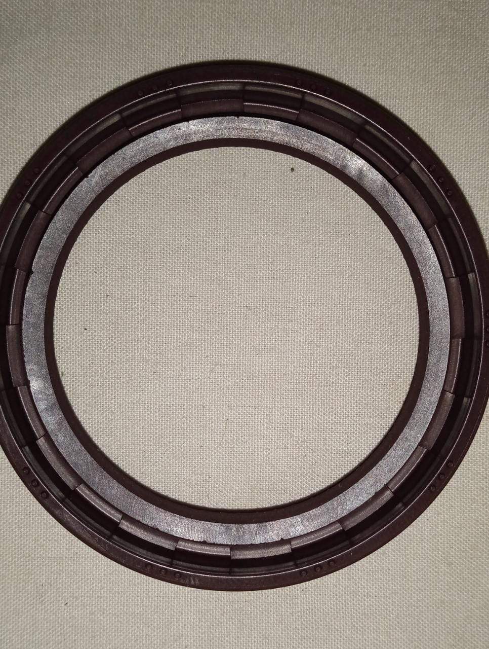 CarTrends Cam Shaft Seal for Optra, close-up of black rubber seal part for engine camshaft protection.