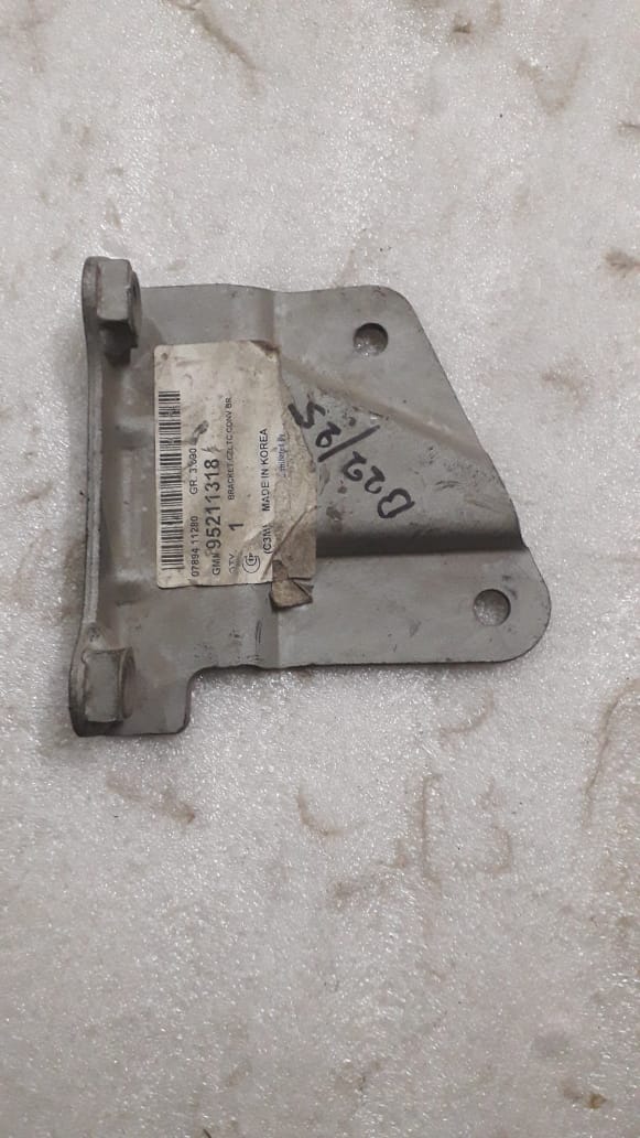 CarTrends catalytic converter bracket spare part, metal bracket with mounting features for vehicle exhaust system.