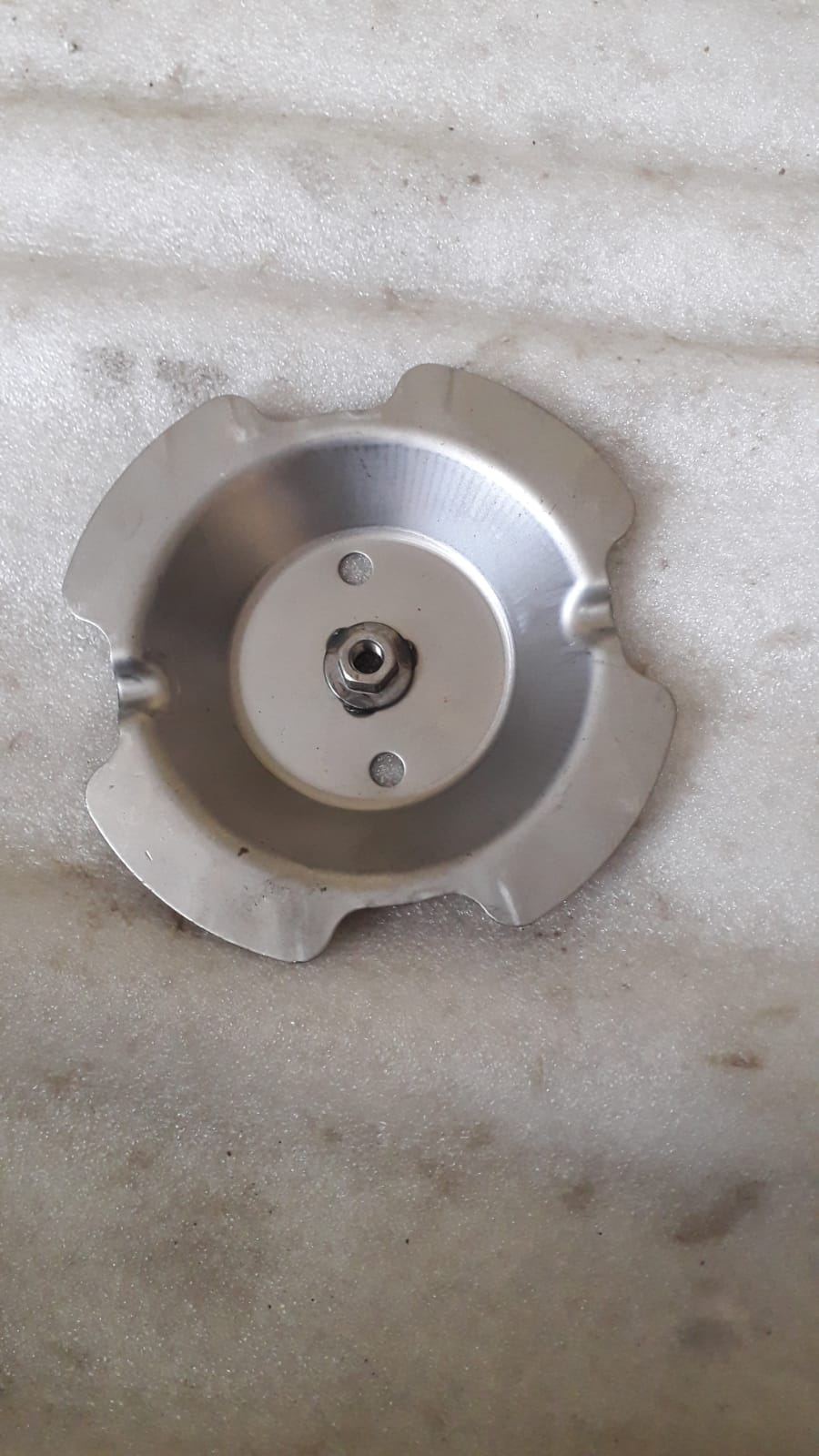 CarTrends wheel stow bracket spare part, showing the metal bracket with mounting features for vehicle storage.