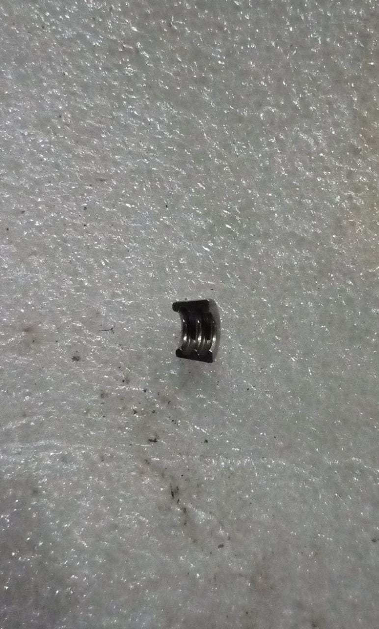 CarTrends Valve Stem Key for Optra spare parts, close-up of the black metal tool used for tire valve maintenance.