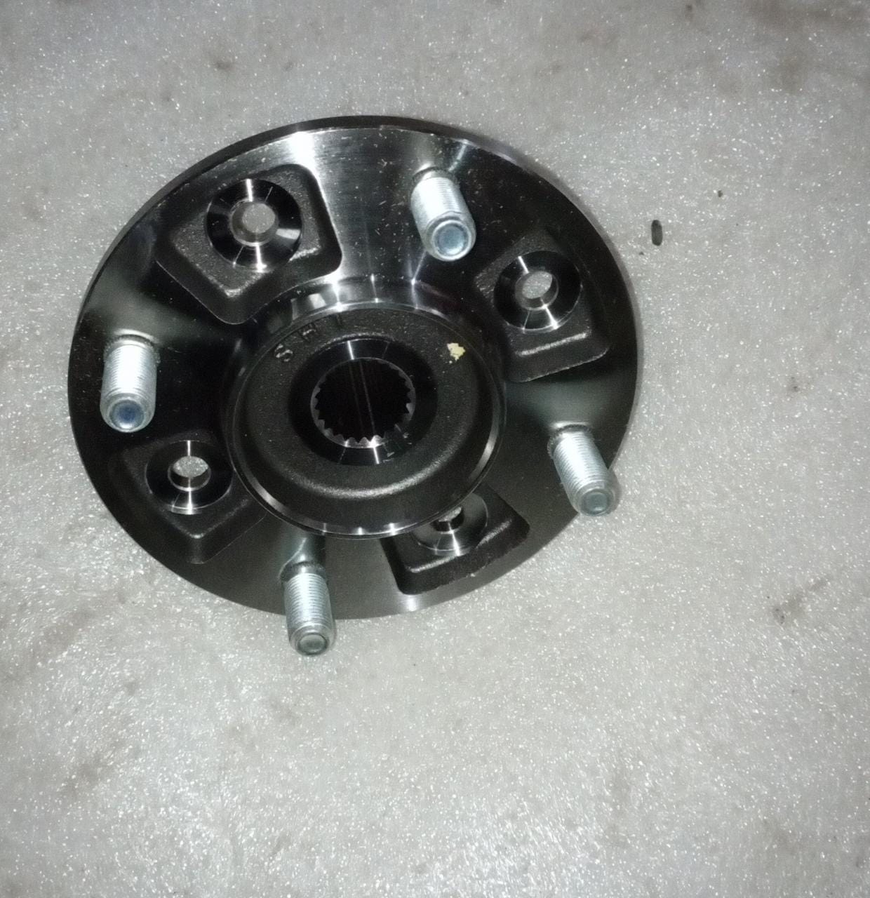 CarTrends J96316756 front hub spark, a spare car part, shown in the image with detailed metal components and mounting points.