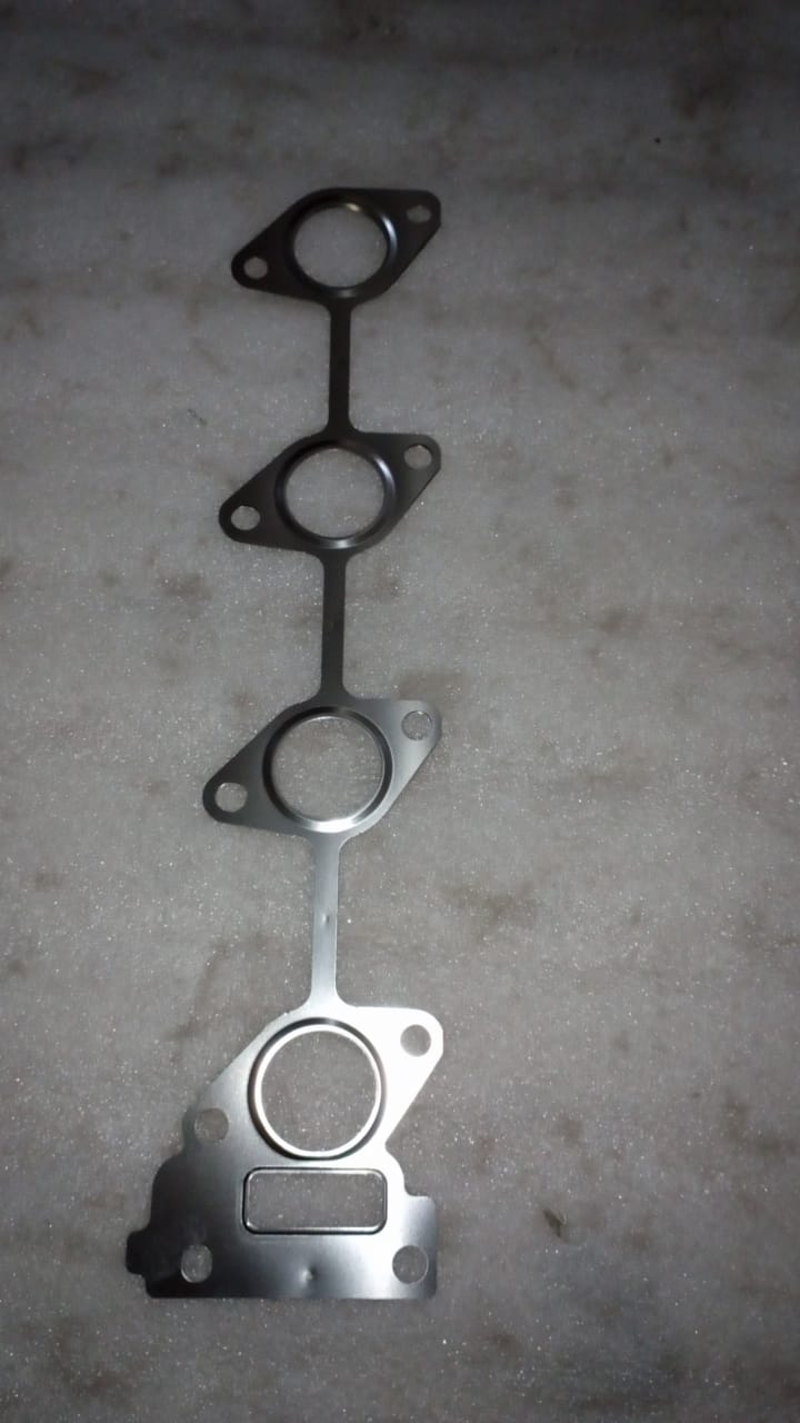 CarTrends exhaust manifold gasket for Opel Optra, close-up of the spare part showing the gasket's detailed design.