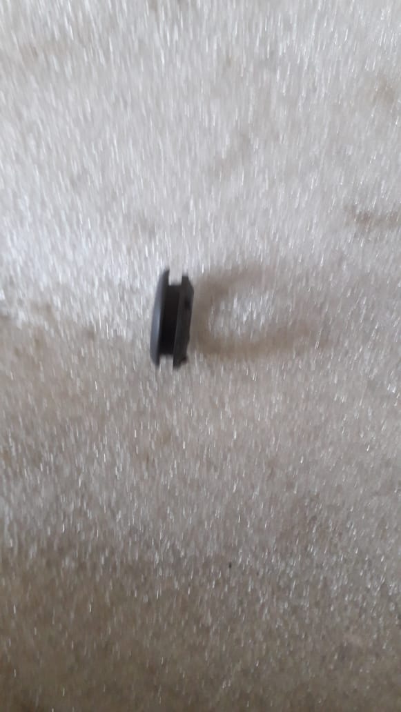 CarTrends Chevrolet Aveo lock button cover, spare auto part showing close-up of the black plastic button cover.
