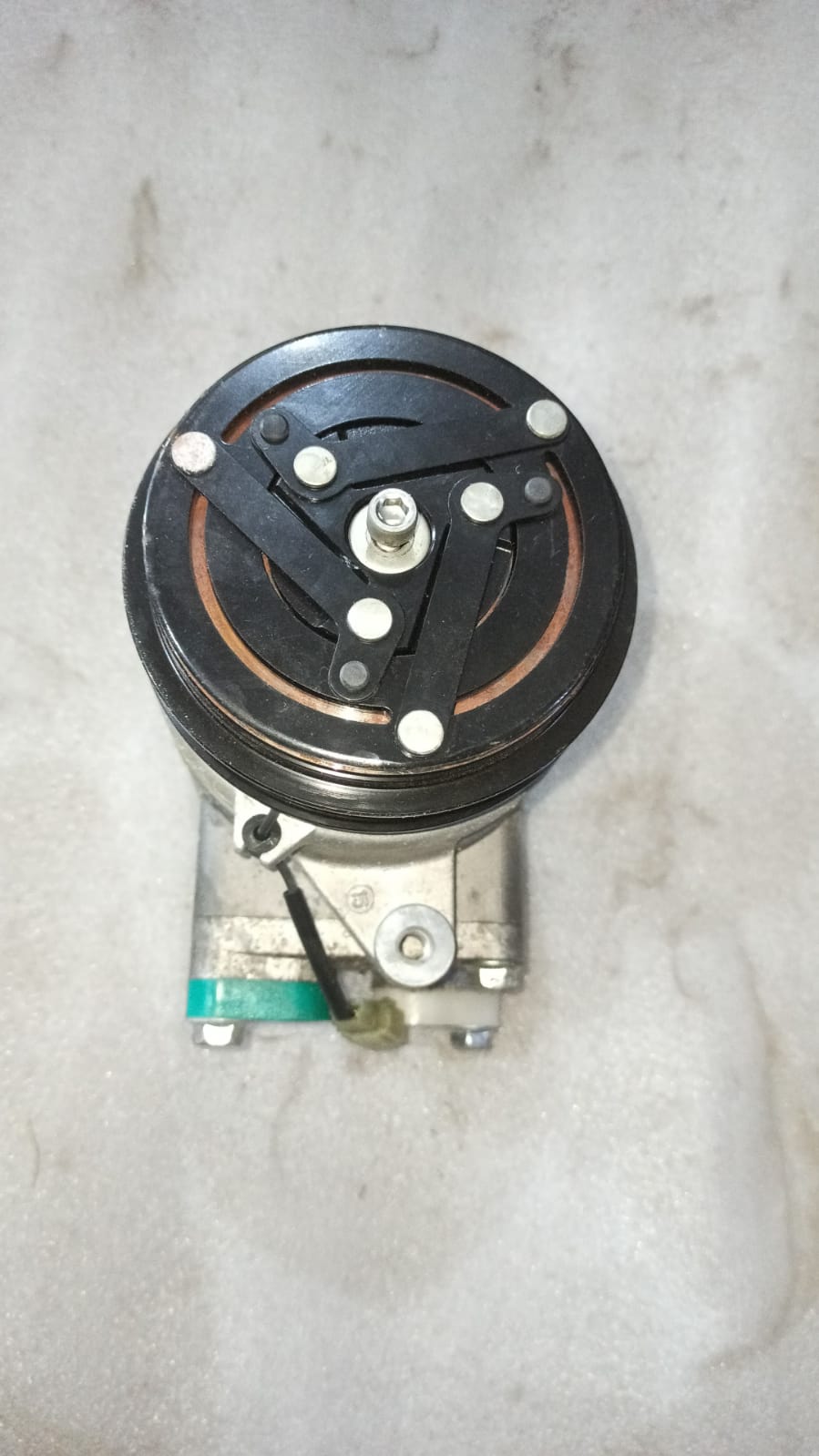 CarTrends AC compressor for Aveo, automotive spare part showing the compressor unit on a plain background.