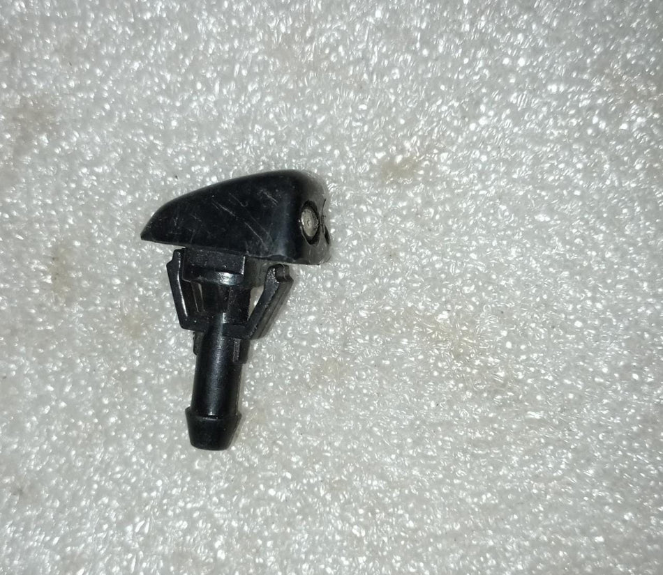 Chevrolet Aveo windshield washer nozzle replacement by CarTrends, close-up of the spare part for easy installation.