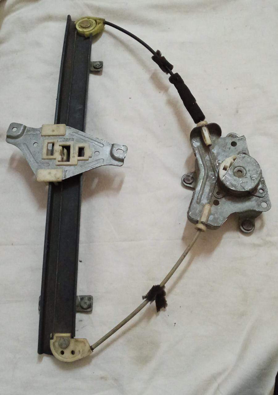 CarTrends Chevrolet Aveo rear right electric window regulator for replacement, showing the mechanical component and wiring.