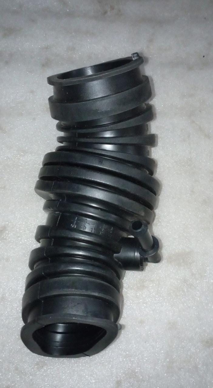 Chevrolet Optra air outlet hose assembly for engine, CarTrends spare part, black rubber hose connected to engine components.