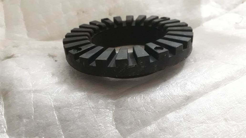 Rear lower insulator spring for Chevrolet Spark by CarTrends, close-up view of the spare part in black rubber with metal components.