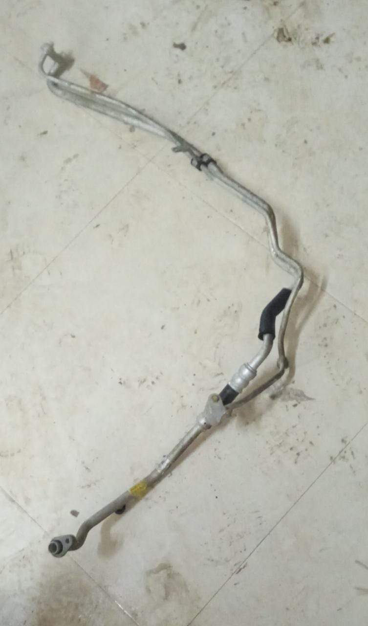 CarTrends AC suction hose for Aveo, spare parts image showing the flexible black hose used in vehicle air conditioning systems.