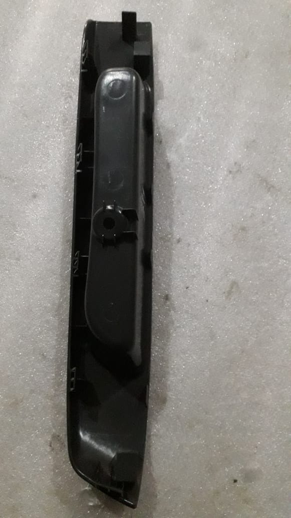 CarTrends Chevrolet Beat rear panel pull strap trim finish, close-up of the spare part on the vehicle's rear side.