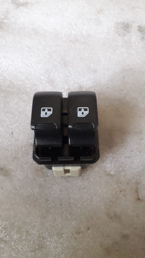 CarTrends power window switch spare part, close-up view showing buttons and electrical connections for vehicle window control.