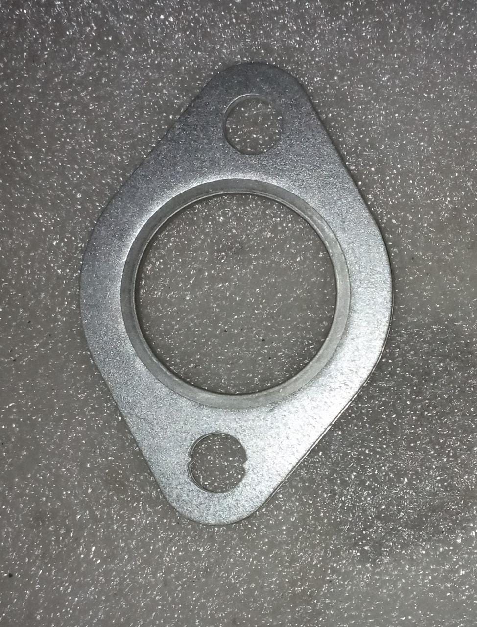 CarTrends exhaust muffler gasket for Chevrolet Spark, spare part with J990141L0, showing the gasket and muffler component.