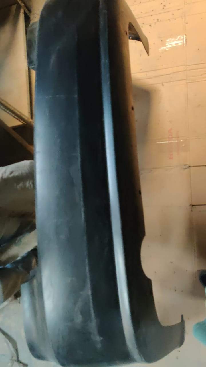 CarTrends rear fascia bumper for Chevrolet Aveo, spare part, showing the black plastic bumper with mounting points.