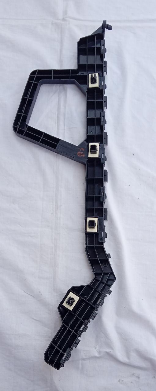 Honda rear right bumper bracket by CarTrends, spare parts for vehicle repair, shown in a close-up image.