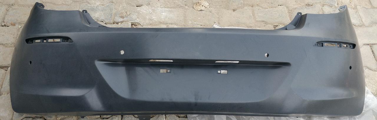 Hyundai i20 rear bumper with sensor from CarTrends, spare part in black with mounting points and sensor hole.