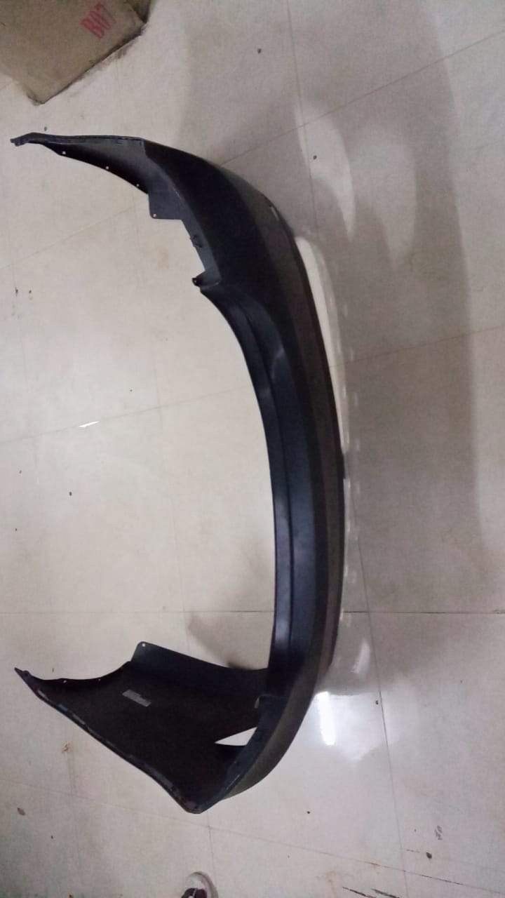 Rear bumper for Verna Fluidic with sensor, CarTrends spare part, showing the black plastic bumper with sensor opening.