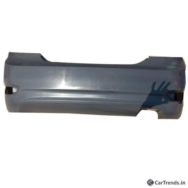 Rear bumper for Hyundai Verna Fluidic by CarTrends, spare part without sensor, shown in black with mounting details.