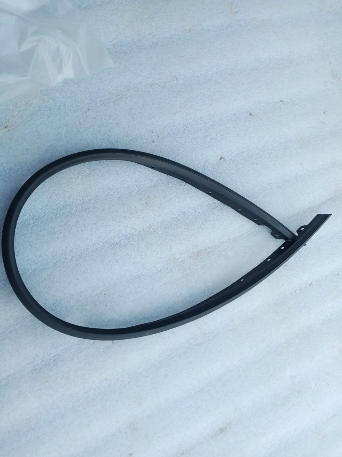 CarTrends front bumper seal spare part for vehicle, showing the black rubber seal attached to the bumper area.
