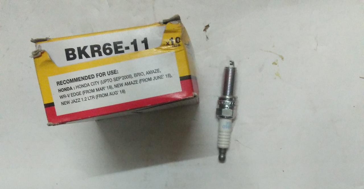 CarTrends Spark Plug Amaze Honda City BKR6E11 spare part, close-up of the ignition component against a neutral background.