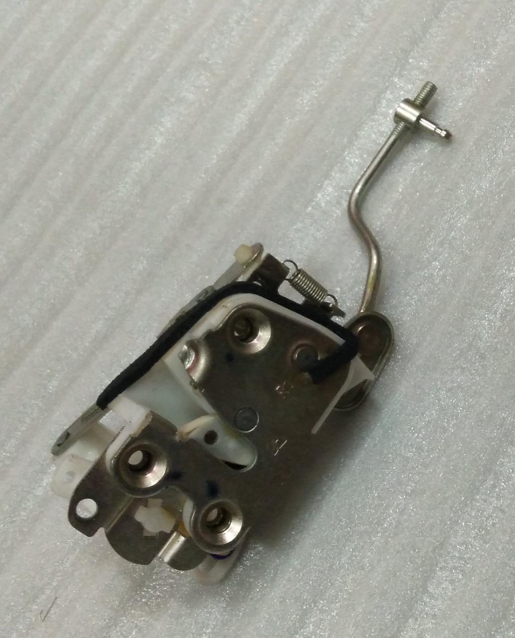 CarTrends Chevrolet Tavera back door lock spare part, close-up view of the lock mechanism on the vehicle's rear door.