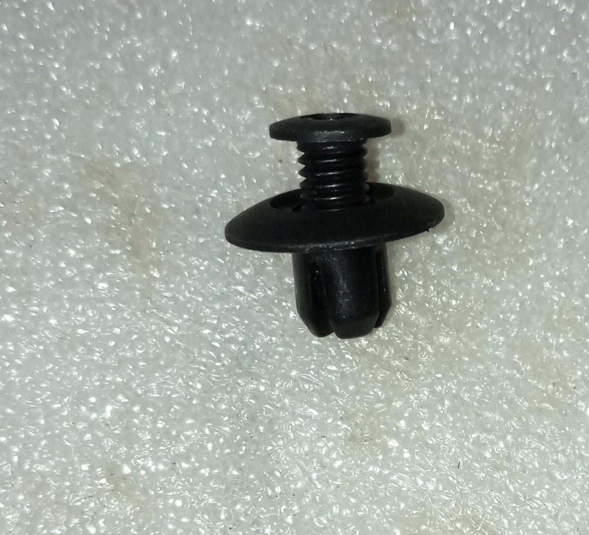 CarTrends T94242150 Fastener Tavera spare part, close-up of the durable automotive fastener for Tavera vehicles.