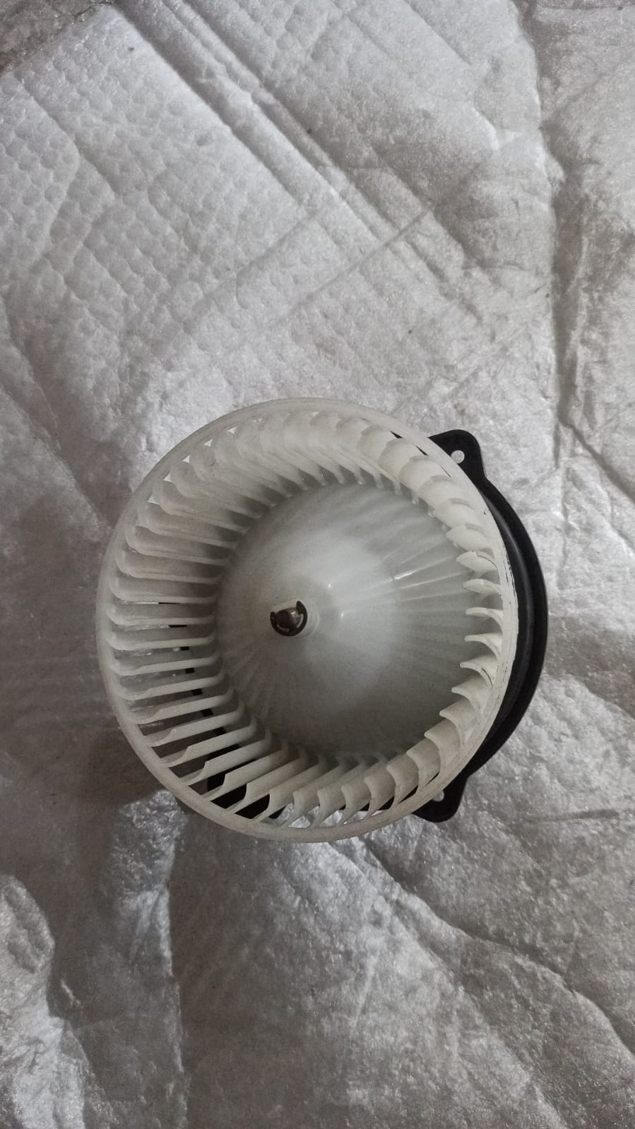 CarTrends T97598525 blower motor for Tavera, automotive spare part, shown in a close-up image.
