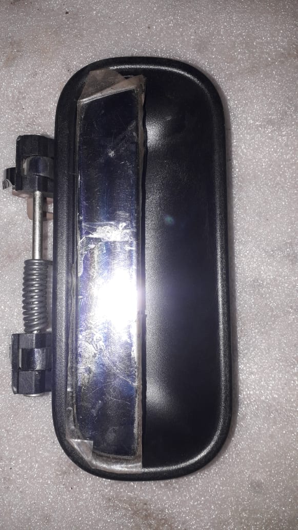 CarTrends T97599384 Tavera left side handle for vehicle spare parts, showing the exterior handle in close-up image.