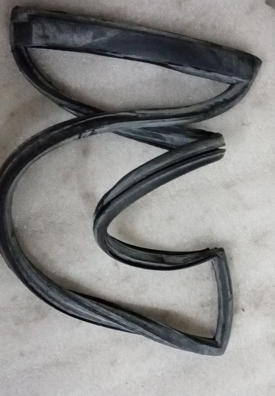 CarTrends T97599863 weatherstrip for Tavera left rear side, close-up view of the spare part for vehicle sealing.