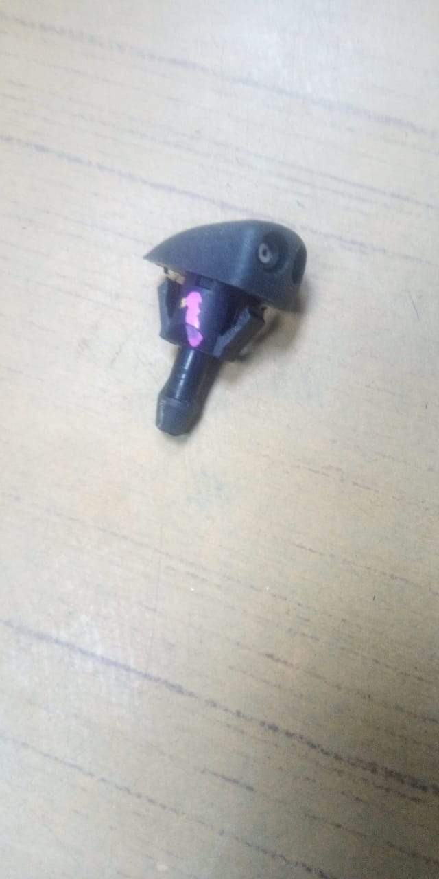 CarTrends Wiper Nozzle Amaze 76810TG1T01 spare part, close-up of the black rubber wiper nozzle for vehicle windshield cleaning.