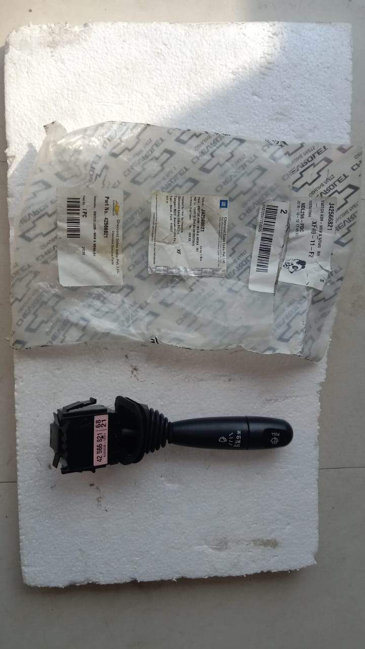CarTrends Wiper Switch Beat, spare auto parts, close-up of the black switch for vehicle windshield wipers.