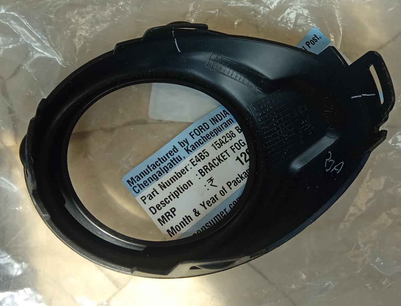 Ford Aspire fog lamp bracket, black mounting hardware for first-generation model, designed for Ford Aspire vehicles.