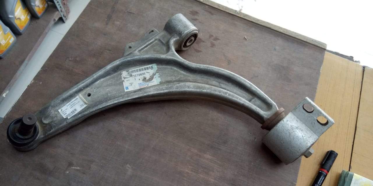 Front lower left control arm with bushing for Chevrolet Cruze, OEM part by General Motors, shown in image.