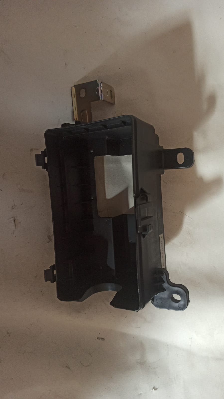 Chevrolet Aveo lower cover part J96650834 by General Motors, close-up view of the black plastic engine bay cover.