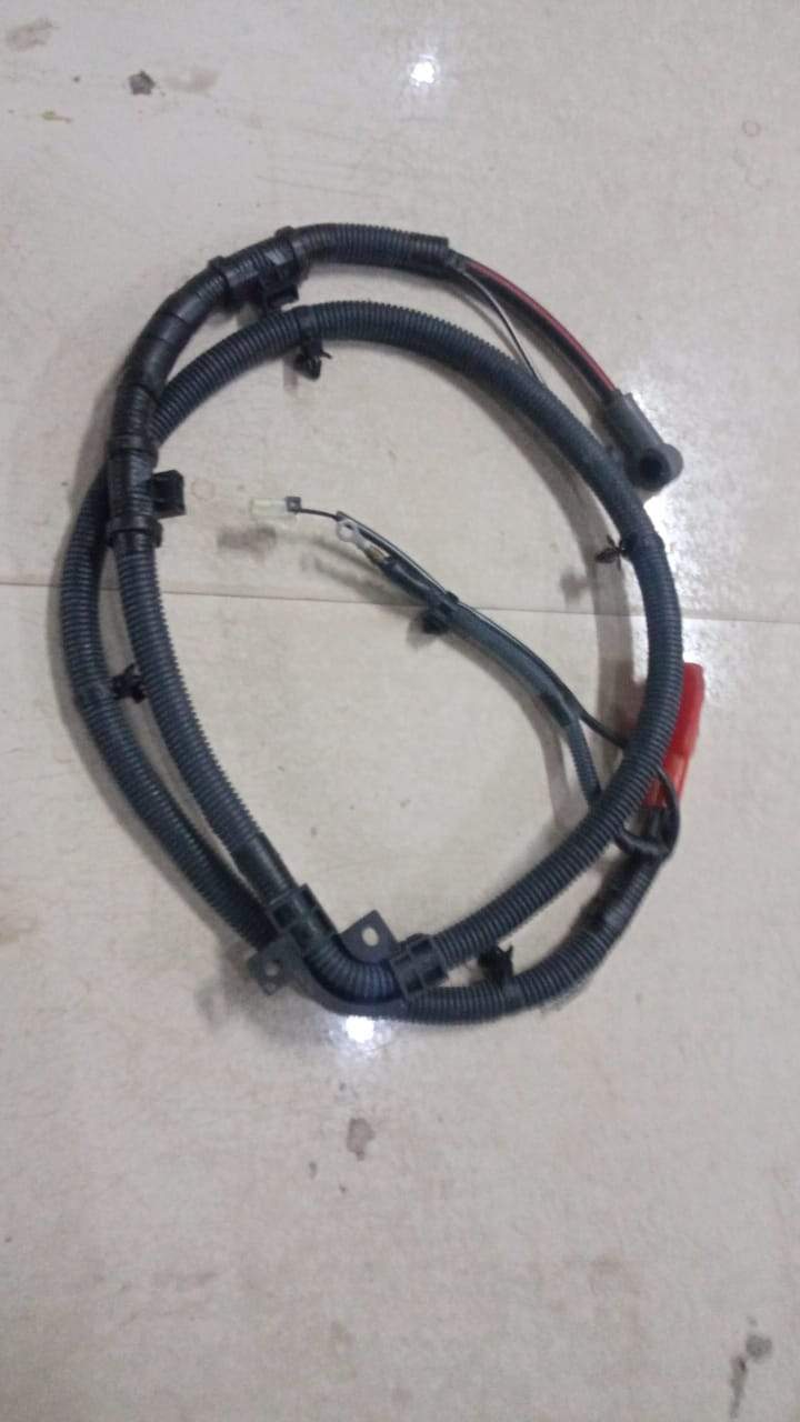 General Motors harness cable for Tavera battery connection, shown with black and red wiring and connectors.