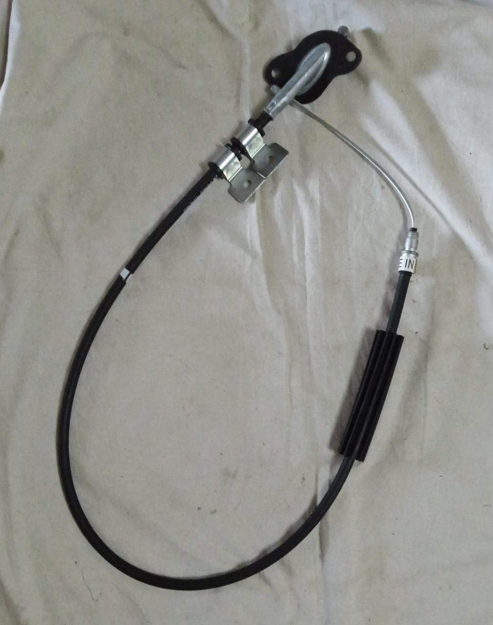 General Motors parking brake cable sail showing the black protective cover and connection points for vehicle safety.
