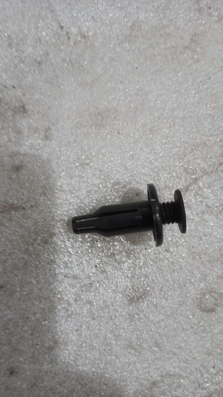 General Motors J94530623 clip button for Opel Optra, close-up view of the black plastic automotive clip.