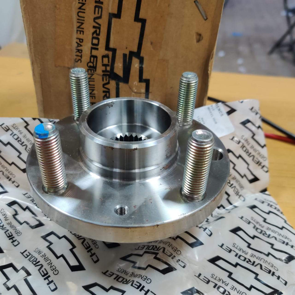 General Motors front wheel hub assembly for J95492092, showing the metal hub component with mounting points.