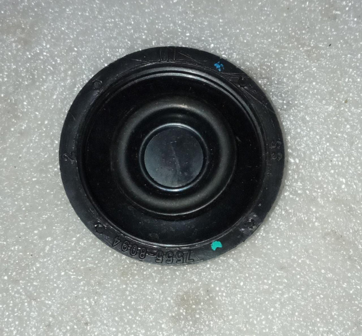 General Motors brake master cap for Optra vehicle, featuring a black plastic design with mounting clips.