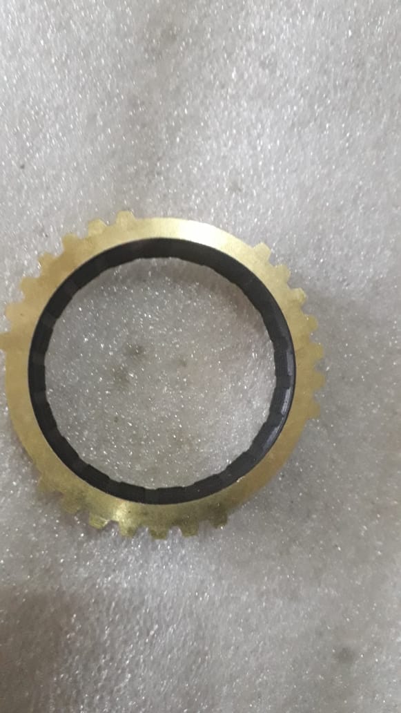 General Motors 3rd gear blocking ring beat for transmission repair, showing the metal ring with gear teeth and wear marks.