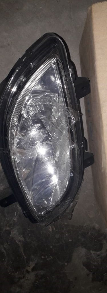 Front fog lamp assembly for Chevrolet Enjoy by General Motors, showing the automotive lighting component.