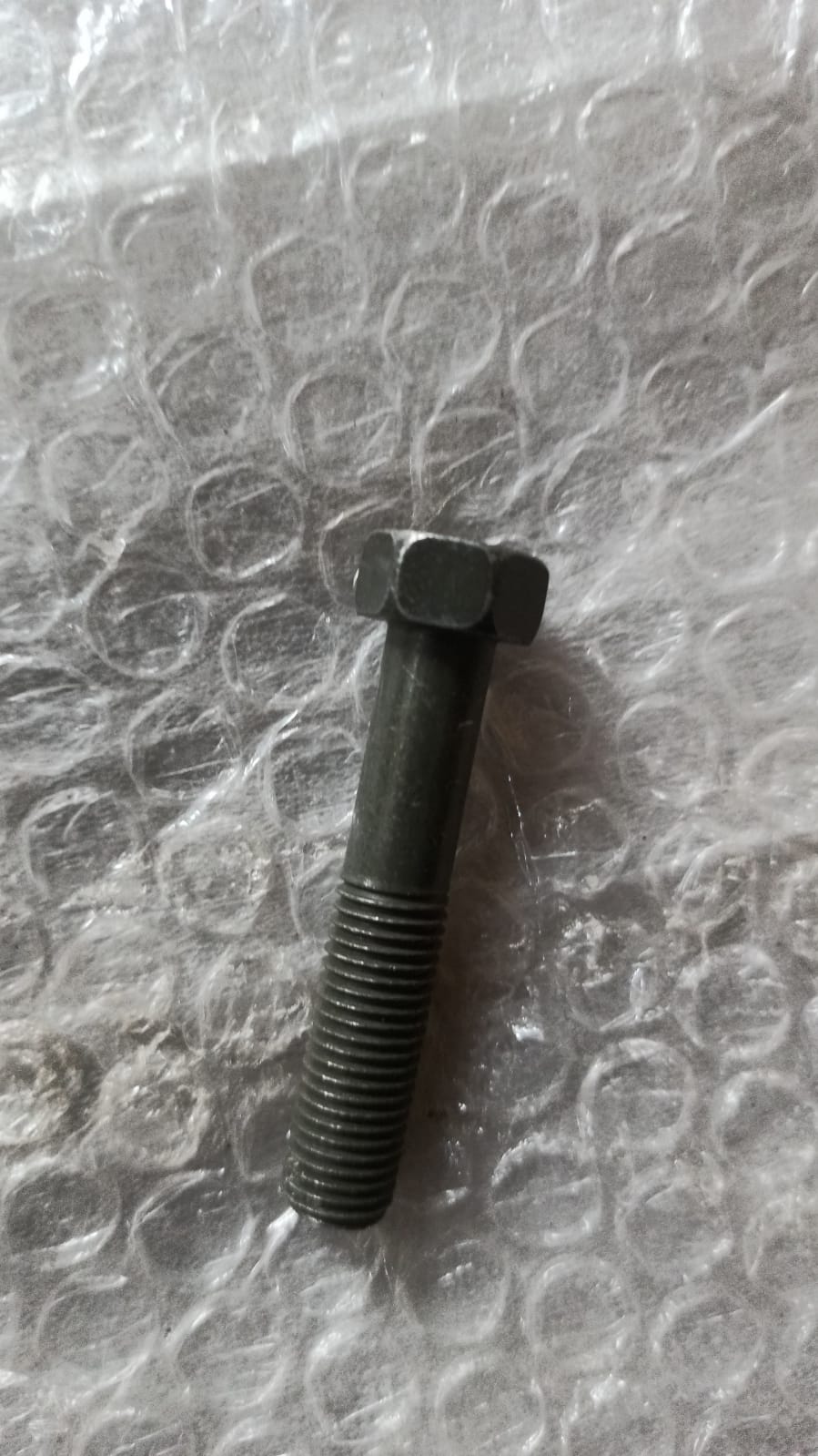 General Motors T94001802 Lower Link Bolt for Tavera, automotive suspension component, shown in the image.
