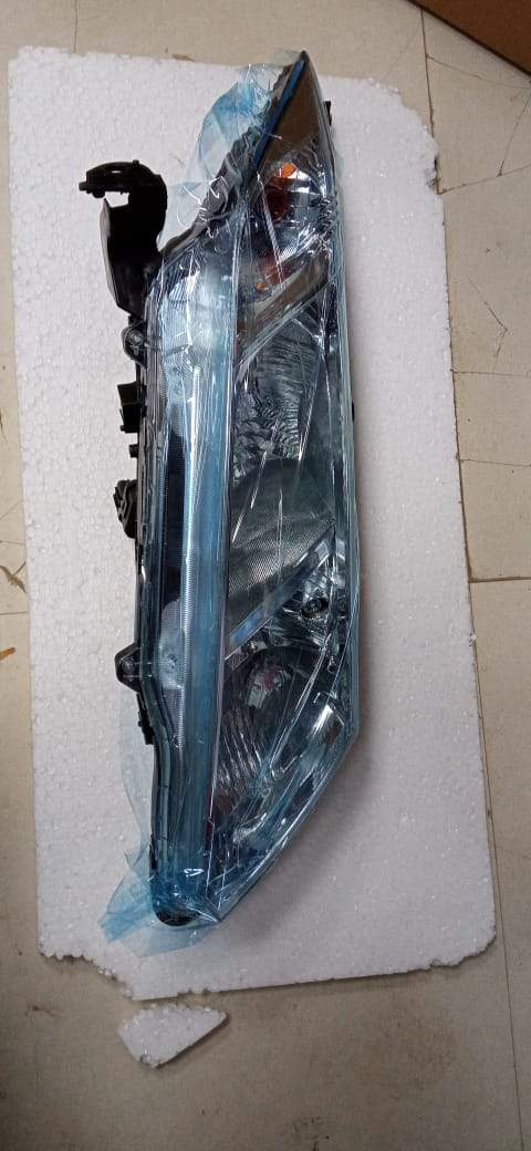 Right side Honda City 6th gen headlight assembly, genuine Honda car headlight for improved visibility and style.